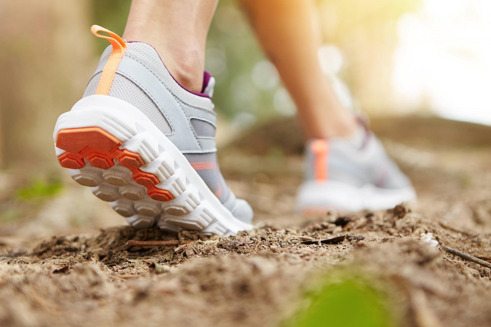 girl-walking-on-nature-trail-at-elements-luther-forst-for-exercsing-as-one-of-her-new-year-healthy-habits