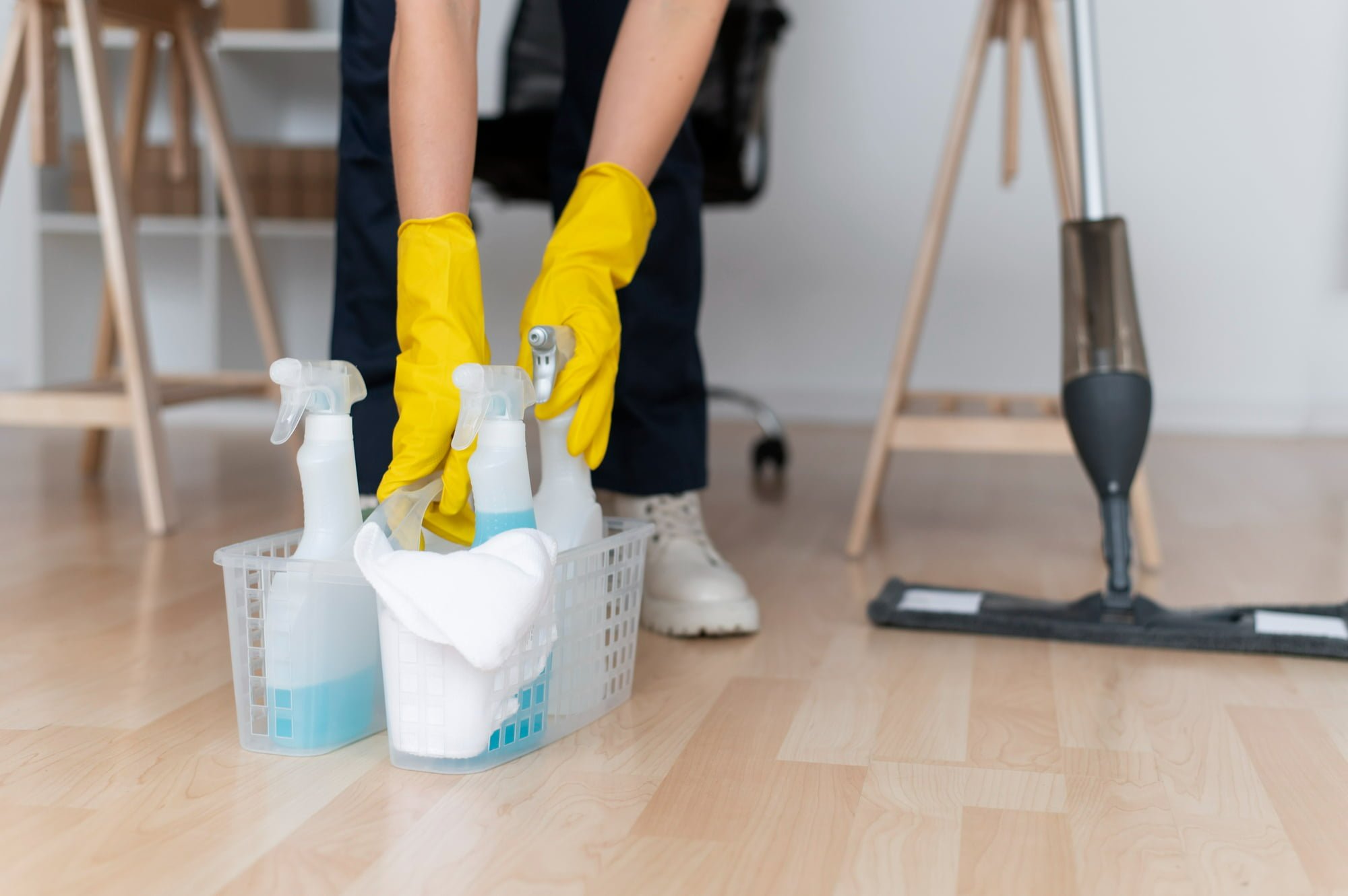 person-mopping-hardwood-floor-following-apartment-spring-cleaning-tips